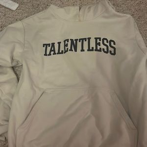 Cream talentless sweatshirt. Navy blue velvet writing